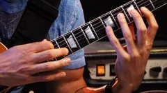 master-tapping-on-electric-guitar-14817